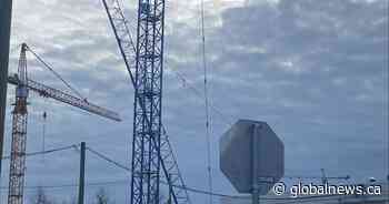 Crane collapses at construction site in Surrey
