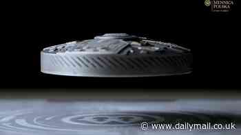 The coin that can LEVITATE and glow in the dark... and it's legal tender! Currency generates magnetic field due to in-built ENGINE