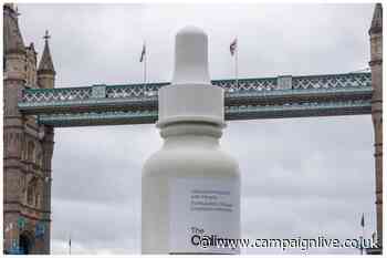 The Ordinary floats giant product bottle down the Thames