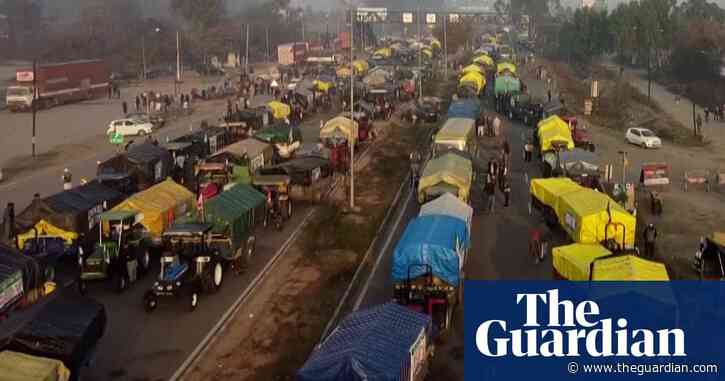 Drone video shows farmers occupying India highroad in pay dispute protest – video