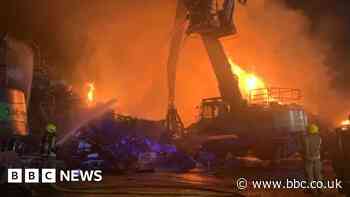 Dozens of firefighters tackle scrapyard blaze
