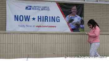 Applications for U.S. jobless benefits fall again as labor market powers on