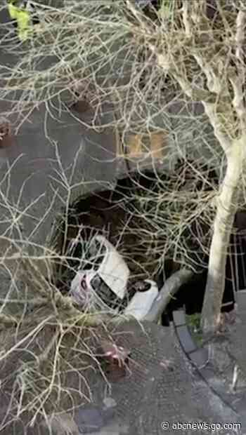 WATCH:  2 cars swallowed by sinkhole