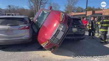 WATCH:  Tight spot: Driver gets wedged between cars in Massachusetts parking lot