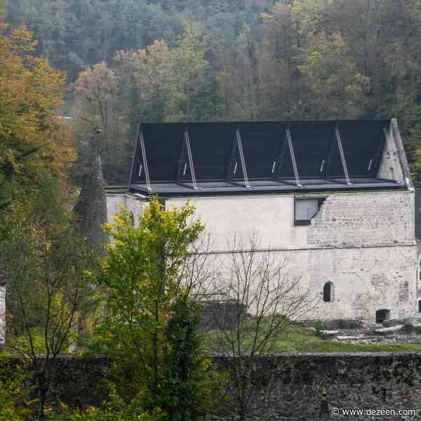 Medprostor tops 12th-century church in Slovenia with folding roof