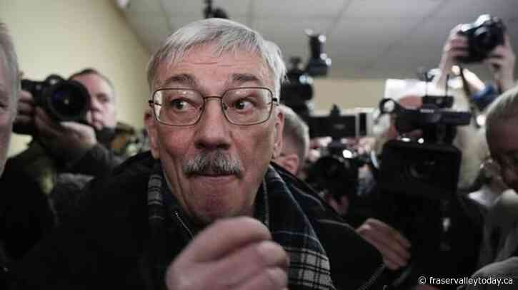 A Russian court sentences the co-chair of a Nobel-winning rights group to 30 months in prison