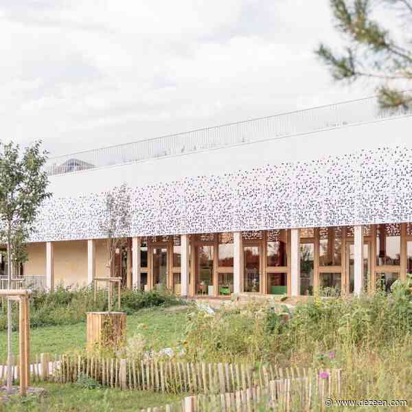 Atelier WOA creates long timber-framed library in France