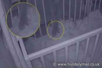 Baby monitor catches 'ghost arm' reaching into cot