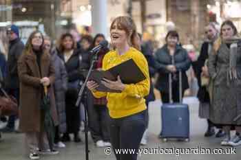 Camilla Kerslake sings at St Pancras International station