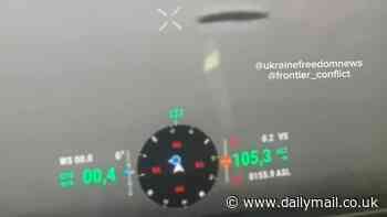 Ukrainian soldier who filmed UFO 'bigger than the Empire State Building' over warzone in Donetsk tells DailyMail.com it sat deathly still against winds and was 'hotter than anything I've ever seen'