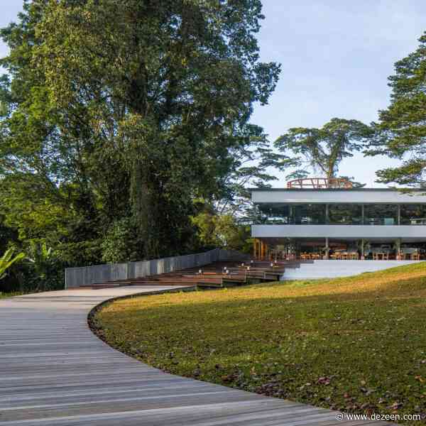 OMA juxtaposes orange-steel cylinder with modernist building for Singapore restaurant