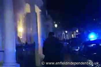 Met Police officers kick door to run into burning building