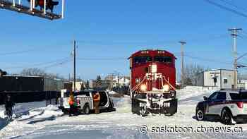 Saskatoon taxi hit by train, police say