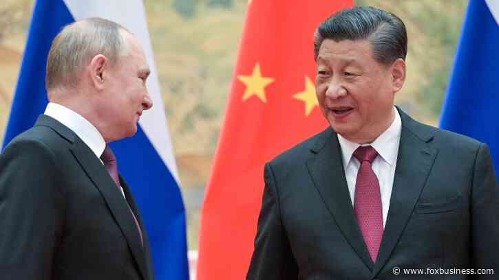 Russia, China team up against the US dollar with planned blockchain payment system