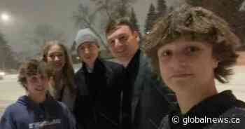 Edmonton Oilers star players push car out of snowbank for local teens