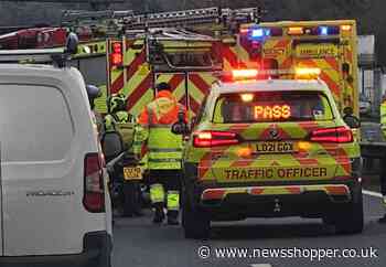 Firefighters cut roof of vehicle and remove person in A20 crash