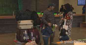 Calgary airport hosts tearful reunion for Afghan refugees: ‘My family is free’