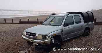Car driven on to Hornsea beach gets stuck in the sand