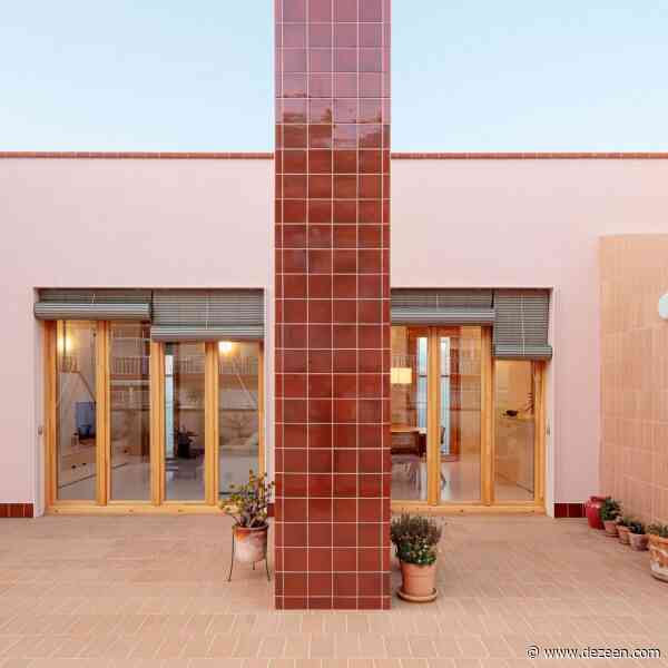 Be Studio punctuates Spanish apartment block with ceramic tiles and green blinds
