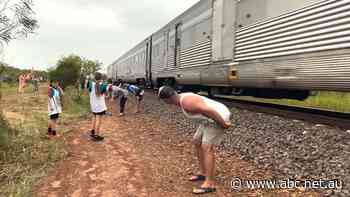In a territory tradition, The Ghan is mooned by hundreds of bare bums near Darwin