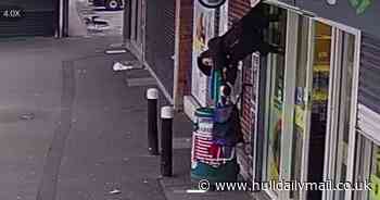 Cleaner caught in shop shutters and suspended 'screaming' eight feet in the air