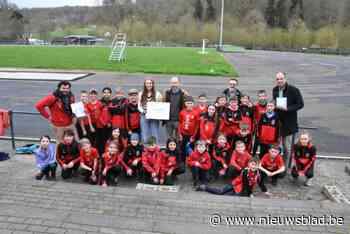 Grootste snoeptaart helpt  aanleg nieuwe atletiekpiste Olympic Essenbeek stukje vooruit