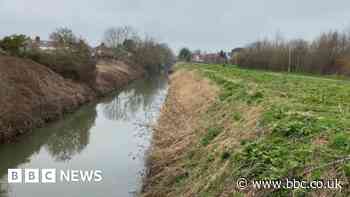 Body found near school not suspicious, police say