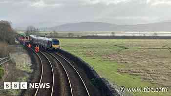 'Big cloud of smoke' as train derails and blocks line