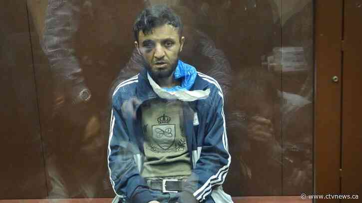 Four men charged in Moscow attack, showing signs of beatings at hearing, court says two accept guilt