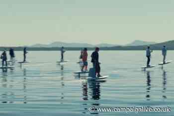 IAG Loyalty stunt shows 35 people performing everyday tasks on fleet of e-foils