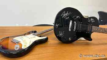 Charity auctions off donated guitar signed by Guns N’ Roses