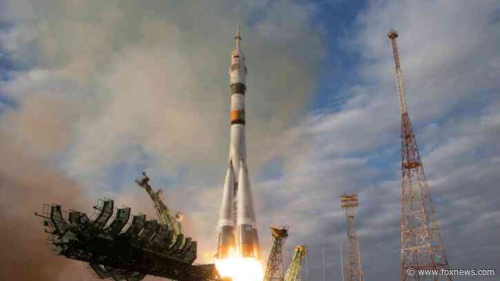 Russian Soyuz spacecraft with 3 astronauts docks at the International Space Station