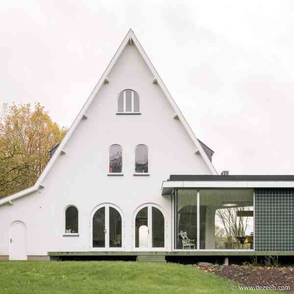 Madam Architectuur perches green-tiled home extension on curved concrete terrace