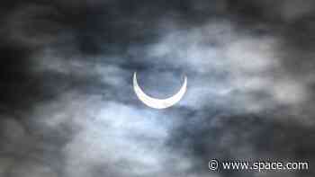 Why low-level clouds vanish during a solar eclipse