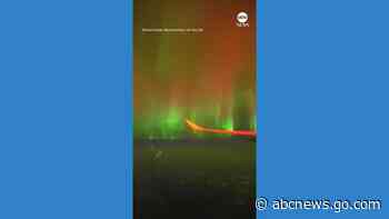 WATCH:  Plane passengers treated to spectacular show of northern lights