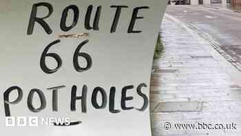 The pothole signs that put a town in the spotlight