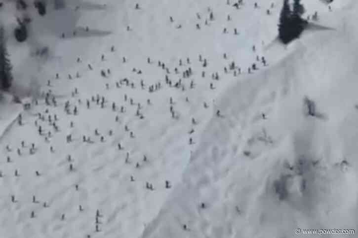 Throngs Of Skiers Clog Ski Trail At European Resort