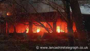 Main road closed after huge fire at Blackburn factory