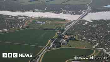 Driver rescued from high tide at island causeway