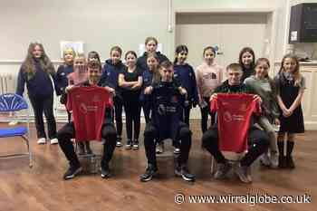 Football kits gifted to girls at Wirral primary school