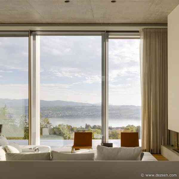 "Water mirror" reflects light into villa overlooking Lake Zurich by PPAA