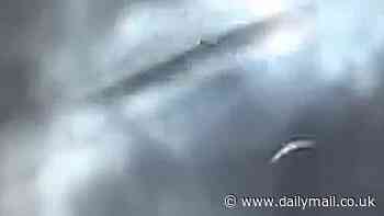 UFO spotted shooting through clouds over Texas during the solar eclipse... do YOU know what it is?