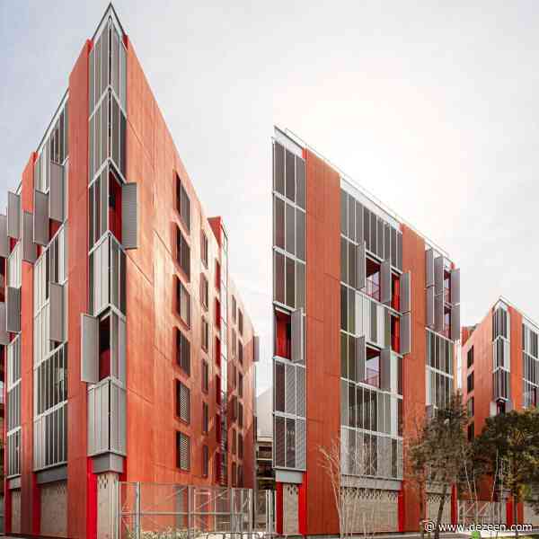 Red accents enliven social housing block on triangular plot in Barcelona