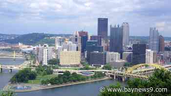 River barges break loose in Pittsburgh, causing damage and closing bridges before some go over a dam