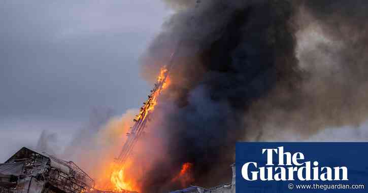 Moment spire collapses at Copenhagen's old stock exchange – video