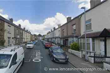 Items stolen and door damaged at property in Burnley