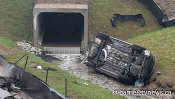 Vehicle rolls into drainage creek off Highway 400 in Barrie