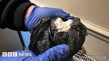 Police seize drugs, cash and a weapon during raids