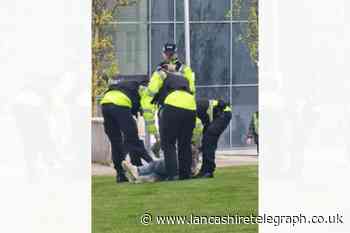 Man arrested during peace protest outside Blackburn Barclays