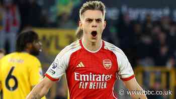 Arsenal win at Wolves to return to top spot